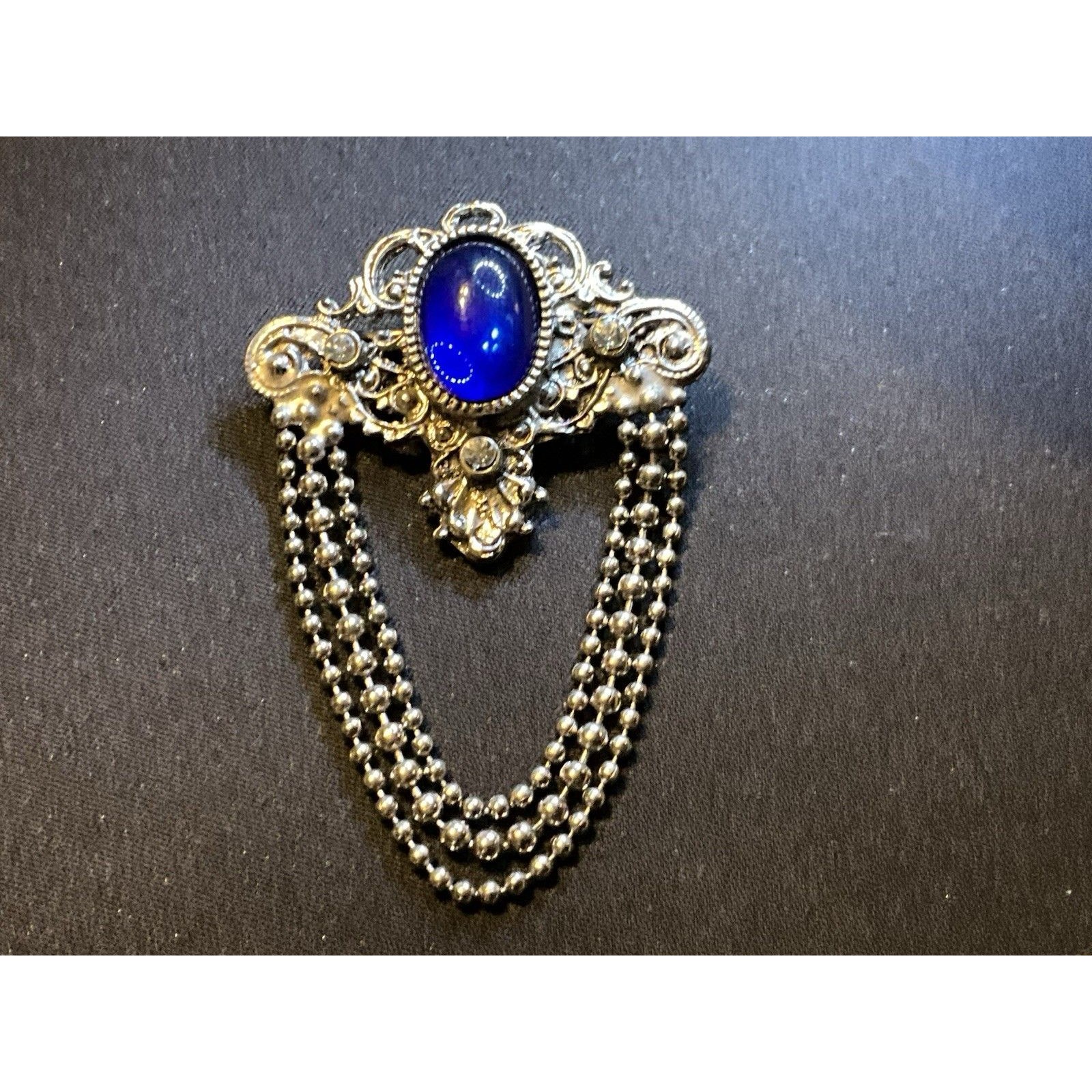 Silver Tone Filigree Blue Cabochon And Chain Dangles Brooch 35$